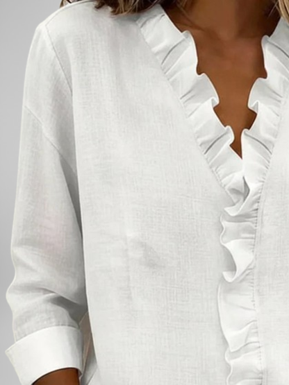 Amoura | Blouse à volants, col en V et manches longues