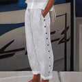 VIENNE – PANTALON RAYÉ À BOUTONS DÉCORATIFS